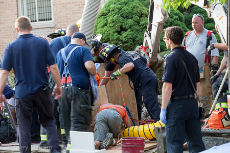 Niles firemen rescue a worker trapped in a hole that collapsed Larry Shapiro photographer shapirophotography.net
